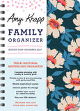 Family organizer with floral design and text on a blue background