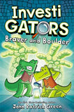Cover of the book 'InvestiGators: Braver and Boulder' featuring cartoon illustrations of two green characters, Mango and Brash, with a third character, Brick, in the background. The setting appears to be a futuristic city with a large robot structure looming in the background.