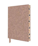 A journal with an embossed floral pattern on a dusty rose cover, featuring decorative blue and gold accents on the spine and a matching rose ribbon bookmark.
