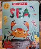 Children's book titled 'Sea' with colorful illustrations of sea creatures on a light blue background.