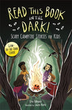 Book cover of 'Read This Book in the Dark! Scary Campfire Stories for Kids' with children around a campfire.