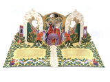 An open 3D pop-up storybook featuring a detailed medieval scene with a crowned queen in a purple gown, surrounded by knights and figures, set against a clean white background.