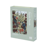 Jigsaw puzzle box with bird and plant design on a light green background
