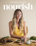 Book cover of 'nourish' by Chelsea Winter featuring a woman at a table with food.