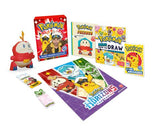 Pokémon trading cards, figurine, and books on a white background