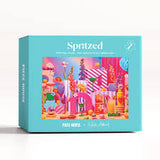 Spritzed product packaging with colorful illustrations on a light blue background