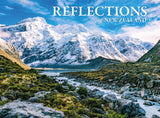 A scenic landscape print or book cover titled "REFLECTIONS of NEW ZEALAND" showing snow-covered mountains, a blue sky, a lake, and a rocky green valley in the foreground.