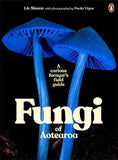 Book cover of 'Fungi of Aotearoa: A Curious Forager's Field Guide' featuring two large blue mushrooms against a black background.